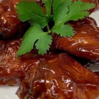 6 Wings · Traditional wings with your choice of buffalo, sweet BBQ, BBQ, mamis special recipe.