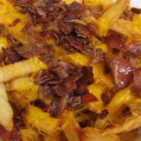 Bacon Cheddar Fries + Sour Cream · French Fries with cheddar melt and bacon bits plus flavored seasonings