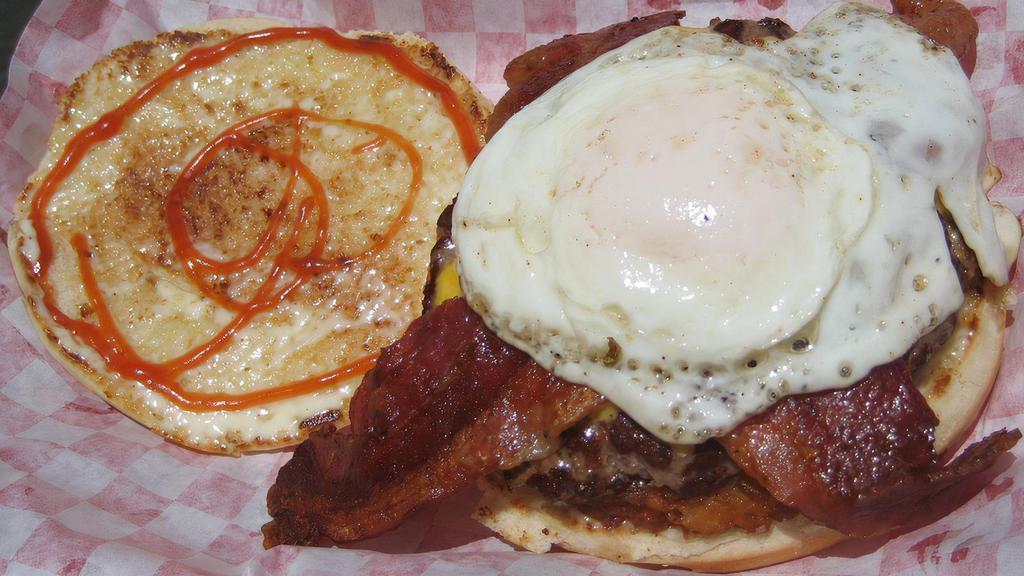 Brunch Burger · 1/4-lb Burger w/ fried egg, cheese, hash brown patty, choice of bacon or ham