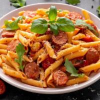 Penne Alla Vodka With Sausage · Freshly made penne pasta with slices of Italian sausage and vodka sauce.