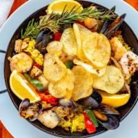Paella · For two. Lola's specialty. Chicken, chorizo, shrimp, mussels, and clams are all sautéed in a...