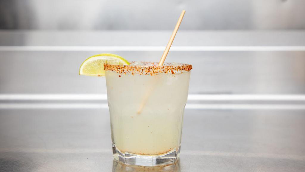 Mexcal Margarita · Sombra Mezcal, Triple Sec, Lime Juice, and Simple Syrup with a Tajin Rim.