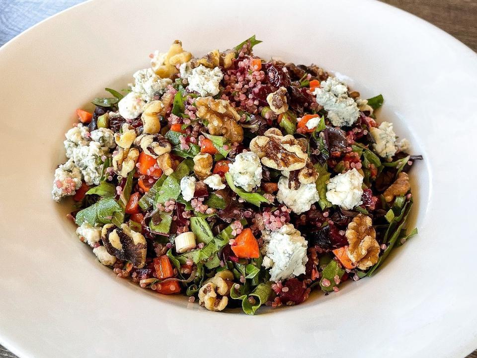 Quinoa Beet Salad · Sweet cooked beets, carrots, scallions, and organic mixed lettuce tossed with dried cherries, walnuts and Gorgonzola cheese in a sherry vinaigrette. Vegetarian, gluten free, contains nuts, can be vegan.