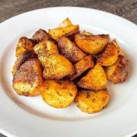 Side Rosemary Potatoes · Quartered, roasted potatoes with rosemary, kosher salt, black pepper, Hugo's seasoning and e...