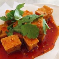 Tamarind Tofu · Crispy fried tofu in a fresh and tangy tamarind sauce. Topped  with cilantro