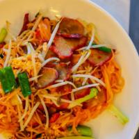 Pad Thai · Rice vermicelli, egg, tangy tamarind sauce, fresh bean sprouts, and crushed peanuts.