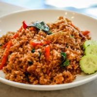 Thai Basil Fried Rice · Jasmine rice stir fried with egg, garlic, bell peppers, onions, carrots, chili, and fresh ba...