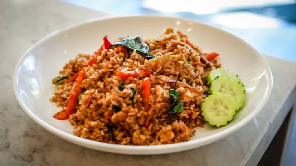 Thai Basil Fried Rice · Jasmine rice stir fried with egg, garlic, bell peppers, onions, carrots, chili, and fresh basil.