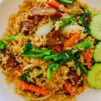 House Fried Rice · Jasmine rice stir fried with egg, Chinese broccoli, onions, and carrots.
