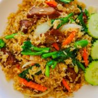 House Fried Rice · Jasmine rice stir fried with Chinese broccoli, onions, and carrots.