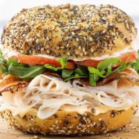 Turkey Chipotle · Roasted turkey, peppered bacon, lettuce, tomato, and chipotle mayo on an everything bagel.