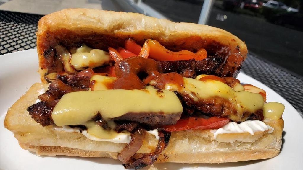 Point Steak · Catch this wave of awesomeness. Smoked & grilled steak with grilled onions, pickled red peppers, cheese, house made steak sauce & mayo on toasted steak roll.