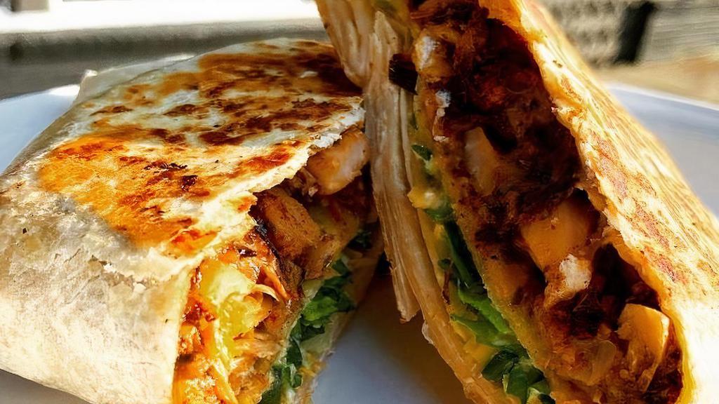 It'S Crunchie - Crunchwrap · Our take on the crunchwrap, vegan style! Comes with crunchy corn tortilla shell wrapped in flour tortilla with queso, pico, guac, sour cream* and lettuce. Add protein for additional charge.. *sour cream contains nuts please avoid or ask for no sour cream if there is a nut allergy