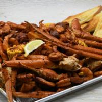Family Crab And Shrimp Boil · Steamed Crab and Shrimp, Corn, Red Potatoes, Andouille Sausage and Garlic Bread. Choice of C...
