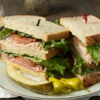 Club House · Ham, turkey, bacon, swiss cheese, mayonnaise, mustard, lettuce and tomato, all on three slic...