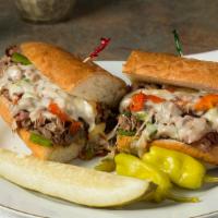Philly Steak Sandwich · Roast beef grilled with onions, bell peppers and provolone cheese on a French roll.