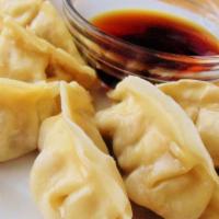 Dumplings · 4 pieces.  Chicken dumplings served with house soy sauce.