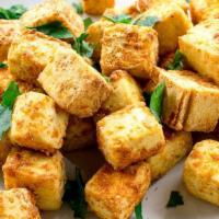 Crispy Tofu · Battered fried tofu platter served with house soy sauce.  Salt & pepper, onions & garlic sty...