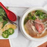 Combo Beef Soup · Combo beef rice noodle pho soup (rare, flank, fatty brisket, tendon, tripe) served with fres...