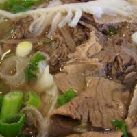 Combo Beef Soup · Combo beef rice noodle pho soup (well done, flank, fatty brisket, tendon, tripe) served with...
