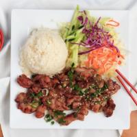 Com Thit · Grilled teriyaki pork with steamed rice served with fresh salad & fish sauce.