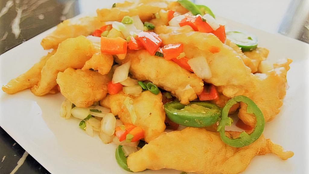 Lemongrass Fish · Spicy, salt & pepper battered basa fish fillet stir fried with fresh lemongrass, onions and garlic served with steamed rice.
