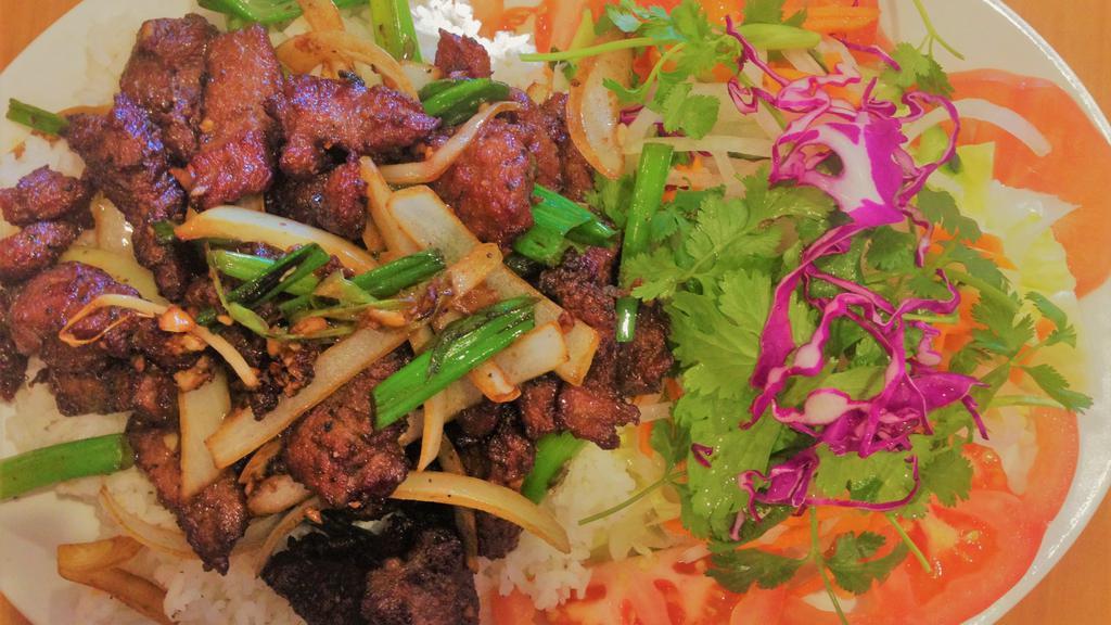 Filet Mignon · House special Napolean sizzling tender filet mignon beef sautéed with onions & garlic served with fresh salad & steamed rice.