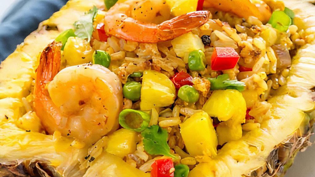 Hawaiian Fried Rice · Hawaiian fried rice with pineapple, egg, peas & carrots, onions, sprouts choice of meat & vegetables.  Combo (pork, chinese sausages, shrimp, chicken), seafood (imitation crab, fish balls, shrimp, squid).