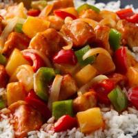 Sweet & Sour Chicken · Pungent sweet & sour chicken served with steamed rice.