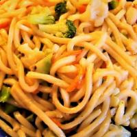 Vegetarian Udon Noodles · Japanese udon rice noodles stir fried with fresh vegetables & tofu.