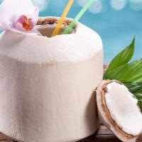 Coconut Juice · Fresh coconut juice in a shell.
