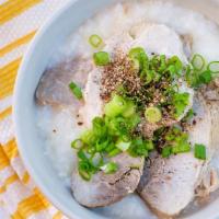 Pork Porridge · Rich pork broth slow cook with Calrose rice.  serve with green onions, black pepper and choi...