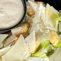 Caesar Salad · Romaine Lettuce, Parmesan Cheese, Croutons and Caesar Dressing.