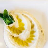 Hummus · Made fresh daily with chickpeas, lemon juice, tahini and garlic, topped with olive oil and p...