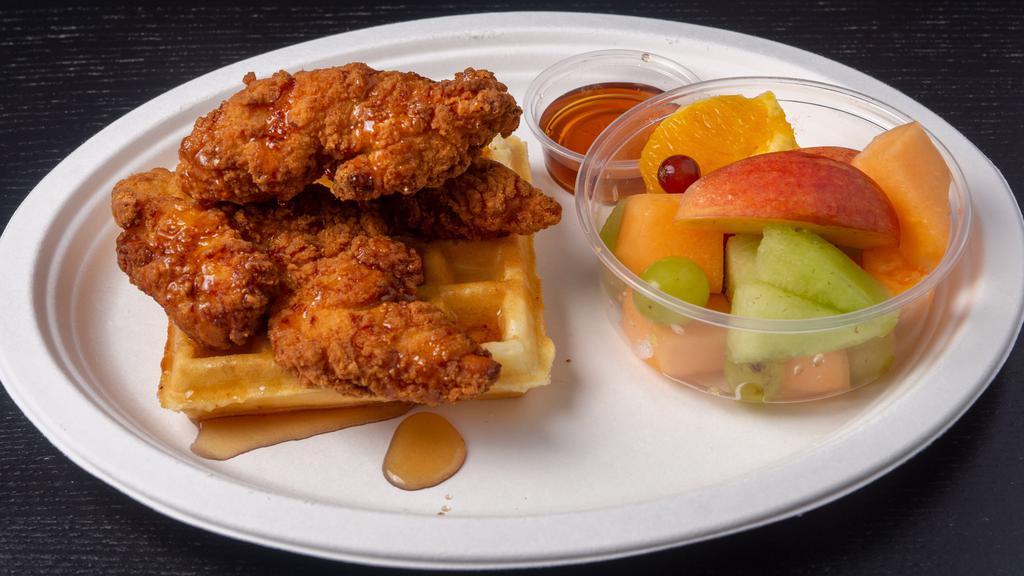 Chicken Tender & Waffle · Belgian waffle cooked in cast iron with buttermilk fried chicken tenders with a side of syrup.