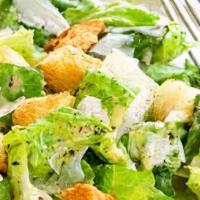 Caesar Salad · Caesar salad with romaine lettuce, parmesan cheese, a side of Caesar dressing