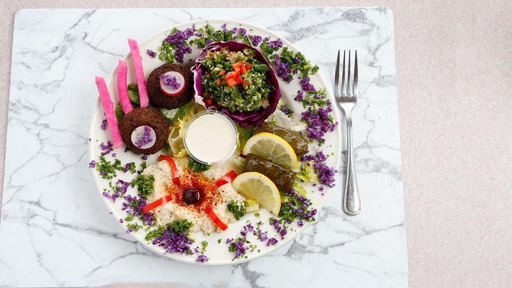 Misto Vegetariana · A delightfully delicious veggie sampler platter of hummus, taboule, 3 dolmathes and 2 falafel.
served with pita and freshly made tahini sauce.