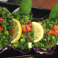 Taboule · Freshly chopped Cracked wheat salad with parsley, tomatoes, green onions, lemon juice and ex...