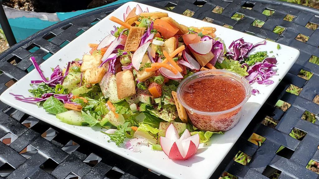 Fatoush · Eastern mediterranean specialty, a vegetarian delight.
Romaine lettuce, cucumber, Roma tomato, red onion, green onion, sliced radish, fresh sumac and pita chips. with our delicious lemon garlic, sumac and olive oil dressing on the side.