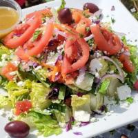 El Greco · Romaine lettuce, Roma tomato, cucumbers, red onions, Kalamata olives and feta cheese. with o...