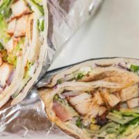 Chicken Kabob Pita Wrap  · chicken pita wrap
Grilled marinated chicken breast chopped up and rolled with hummus, romain...