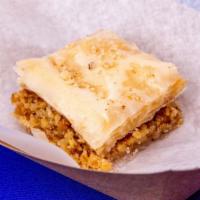 Regular Baklava  · Regular baklava comprised of phyllo dough sheets, chopped walnuts, and topped with the syrup