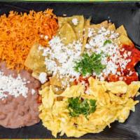 Chilaquiles · Sauteed tortilla chips with green or red sauce and topped with mexican cheese. Served with r...