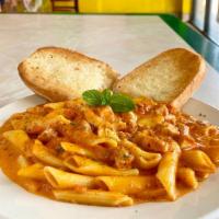Italian Pasta · Penne pasta, grilled chicken, cream sauce, meat sauce, basil, parsley, olive oil and fresh g...