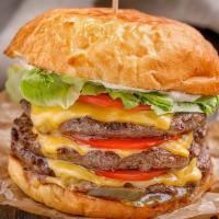 Super Burger (Triple) · Juicy grilled beef burger smashed to perfection and stacked on top of fresh shredded lettuce...