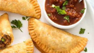 Empanadas · Potatoes and chorizo inside a fried corn-based pastry. Served with guacamole or black bean p...
