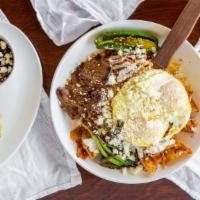 Roosters Chilaquiles · Tortilla chips sautéed in your choice of red or green sauce, steak, two eggs any style, onio...