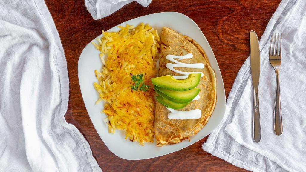 Border Crepe · Chorizo, bell peppers, onions, jalapenos, sour cream, sliced avocado, and jack cheese.