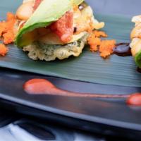 Tuna Surfboars · Deep fried zucchini topped with spicy tuna, thinly sliced avocado & masago, w/ special sauce.