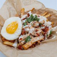 Hot Mess · Fries topped with Parmesan cheese, comeback sauce, sunny side egg, and one big tender.